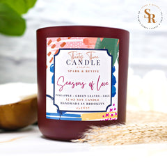 Uplift your mood and awaken your senses with our Seasons of Love scented soy candle. Seasons of Love is a sweet but not overwhelming blend of pineapple, sage, and green leaves. It is sure to put you in good spirits and bring love to your day. Seasons of Love is infused with natural essential oils, including eucalyptus, cedar, vetiver, palmarosa, clary sage, lemongrass, amyris, black pepper, cade, and blue chamomile flower. @SparkandRevive